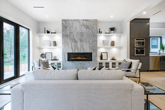 living room white couch fireplace marble statement wall