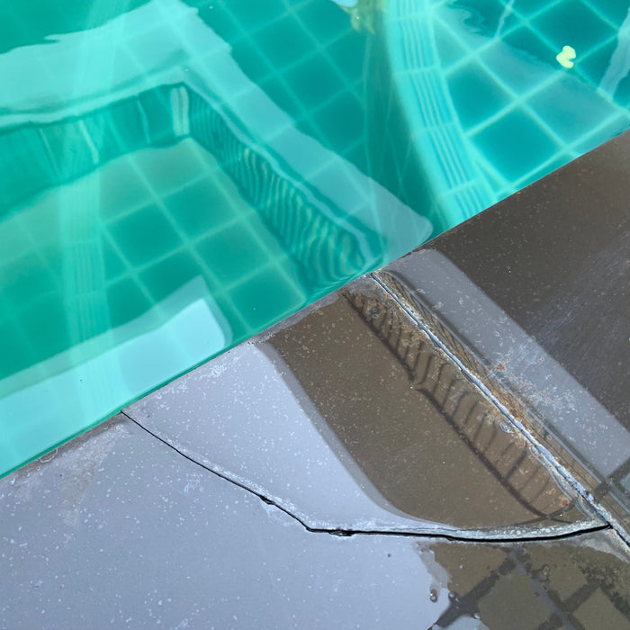 Cracked Tile at the Edge of a Swimming Pool
