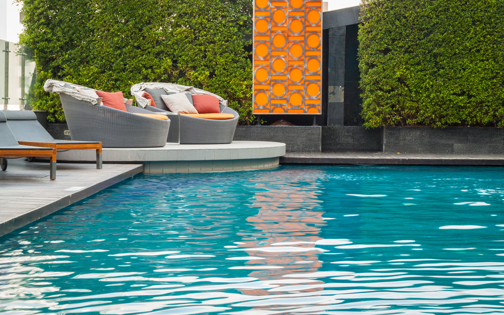 Luxury Swimming Pool with Sofas in the Background