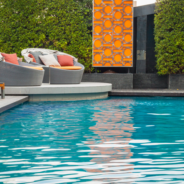 Luxury Swimming Pool with Sofas in the Background