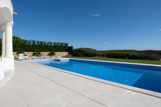 Large Mediterranean-Style Swimming Pool in the Garden of a Luxury Villa 