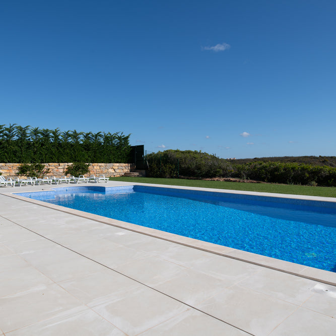 Large Mediterranean-Style Swimming Pool in the Garden of a Luxury Villa 